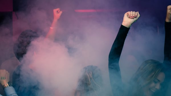 People dancing in fog at a party.jpg