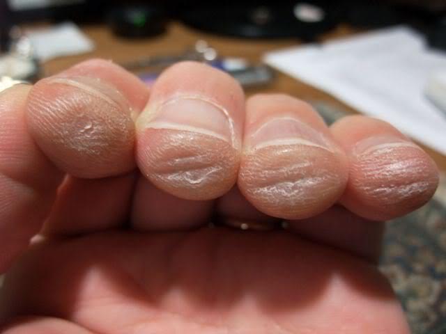 Fingers from shop playing guitar