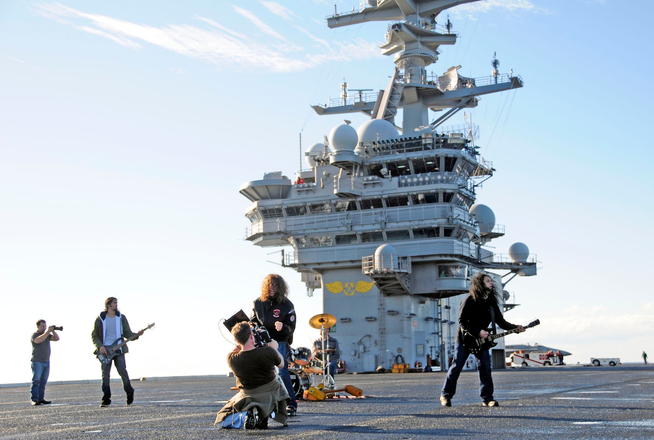 US_Navy_101201-N-8913A-254_Members_of_the_North_Carolina-based_band_Airiel_Down_film_a_music_video_on_the_flight_deck_of_the_aircraft_carrier_USS_G.jpg